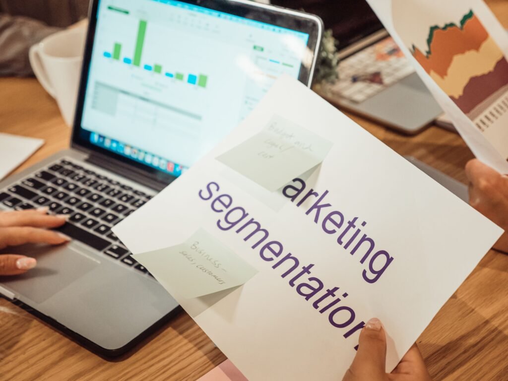 Top 5 Digital Marketing Courses in Borivali Mumbai A modern workspace showing hands analyzing marketing data on a laptop and paper documents.